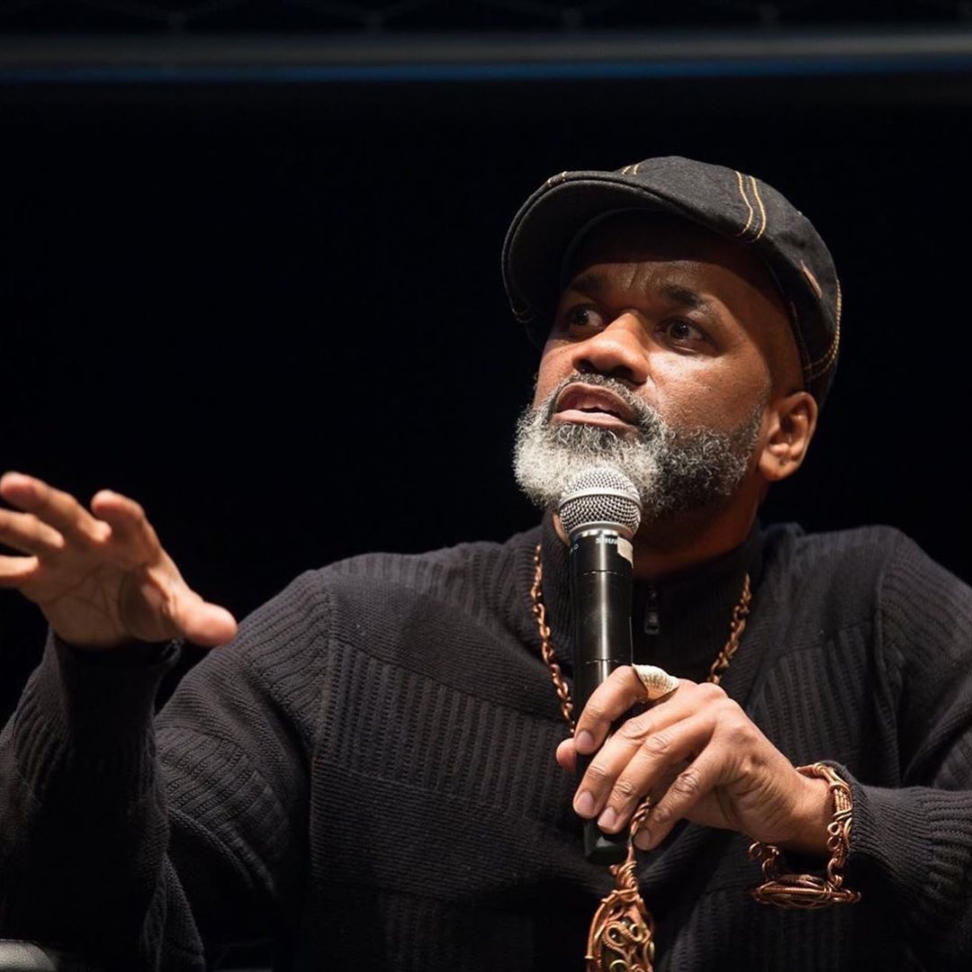 Dawud speaking with microphone
